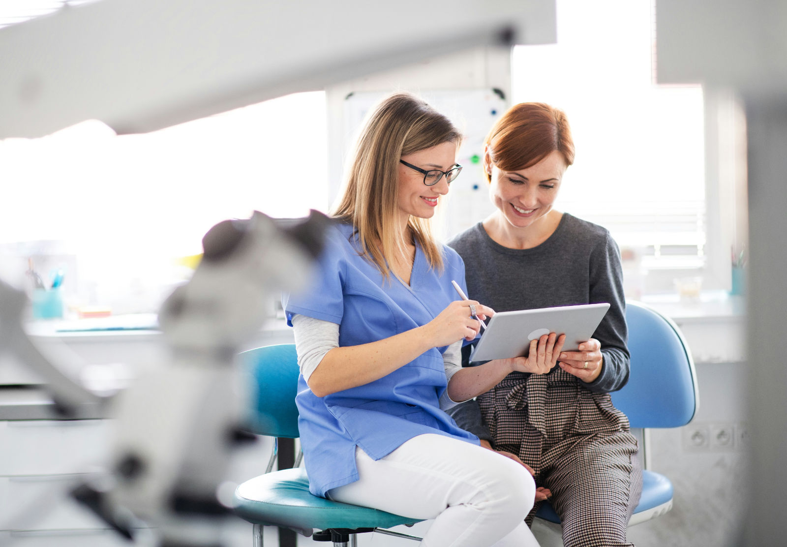 Dental office manager and hygienist review amalgam recycling schedule