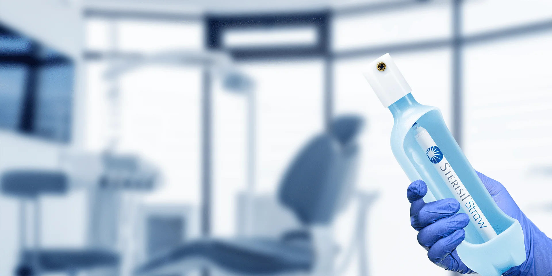 A gloved hand holds a Sterisil product in a dental office