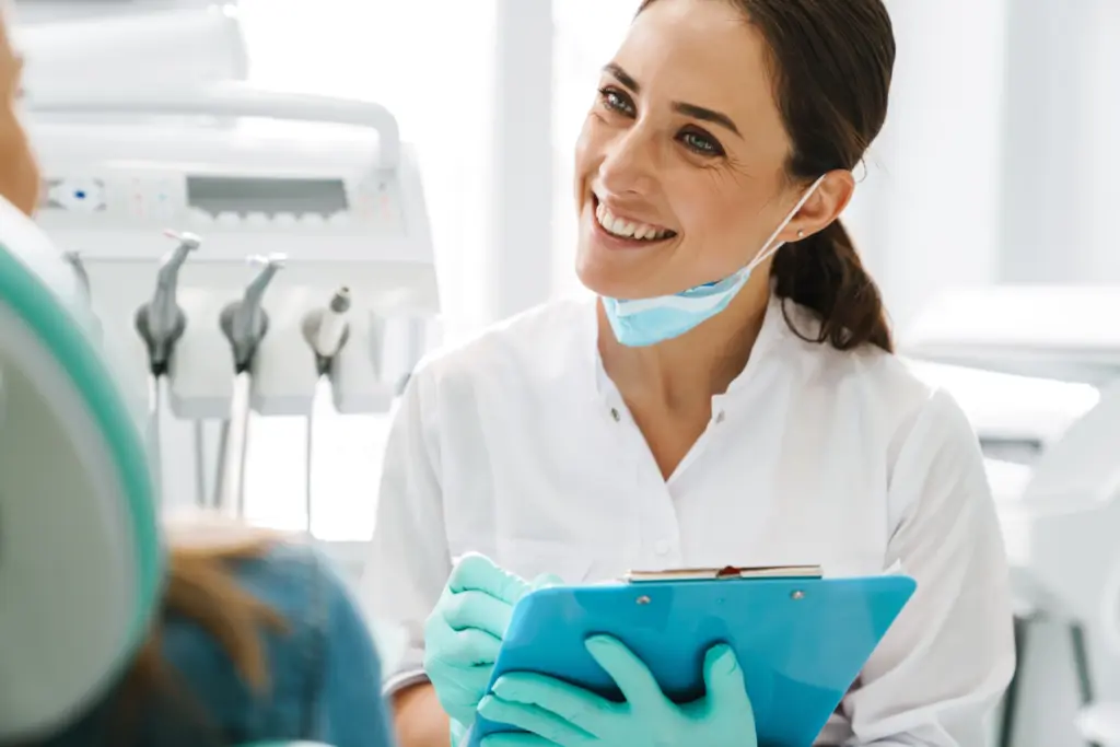 A dental hygienist smiles confidently
