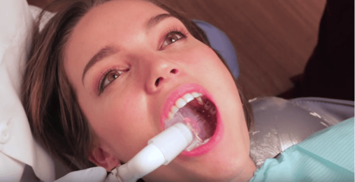 A woman at the dentist using DryShield