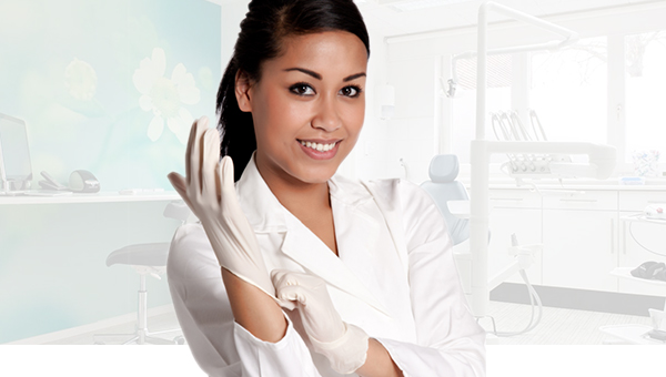 Dentist putting on gloves