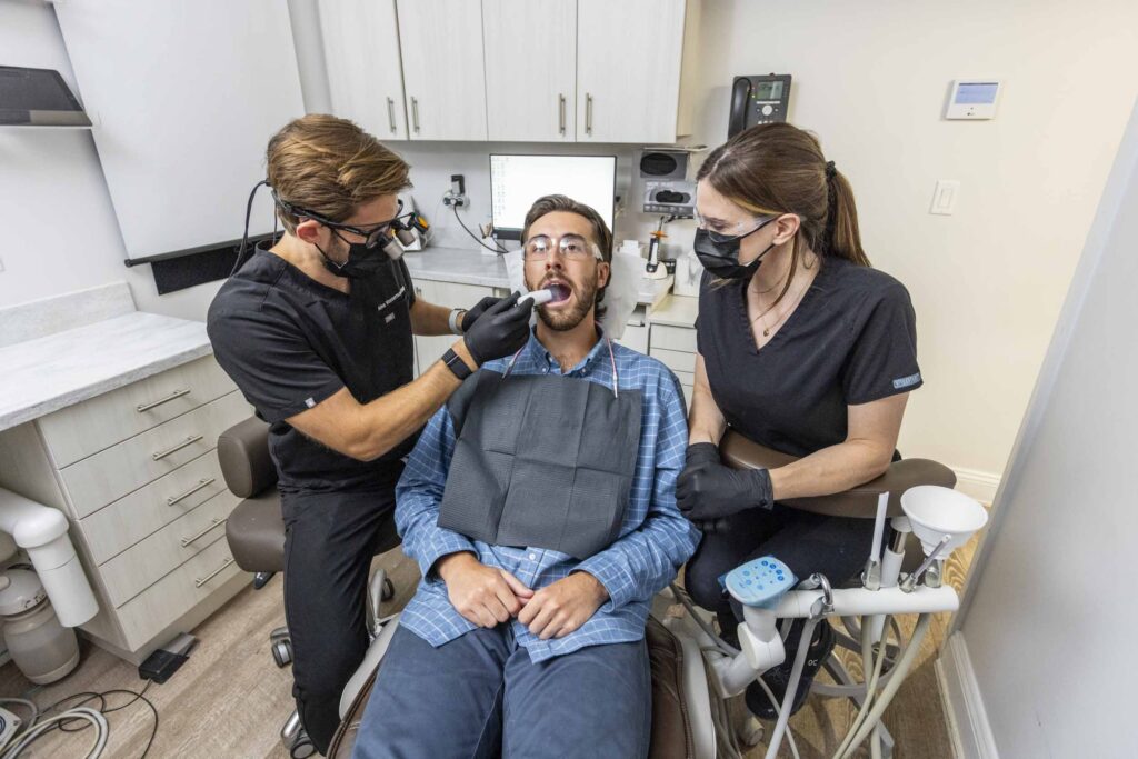 dental assistant assisting a procedure using DryShield